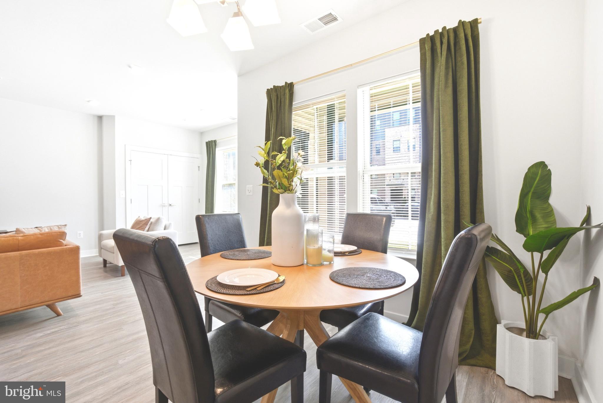 10020 Ruffian Way, Unit A Laurel, MD 20723 - Photo 4 of 36 a view of a dining room with furniture window and wooden floor