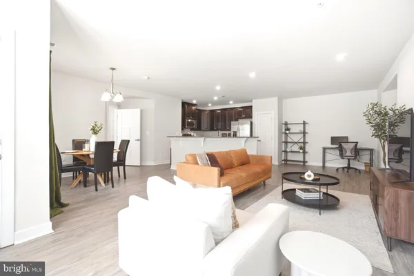 a living room with furniture and a table