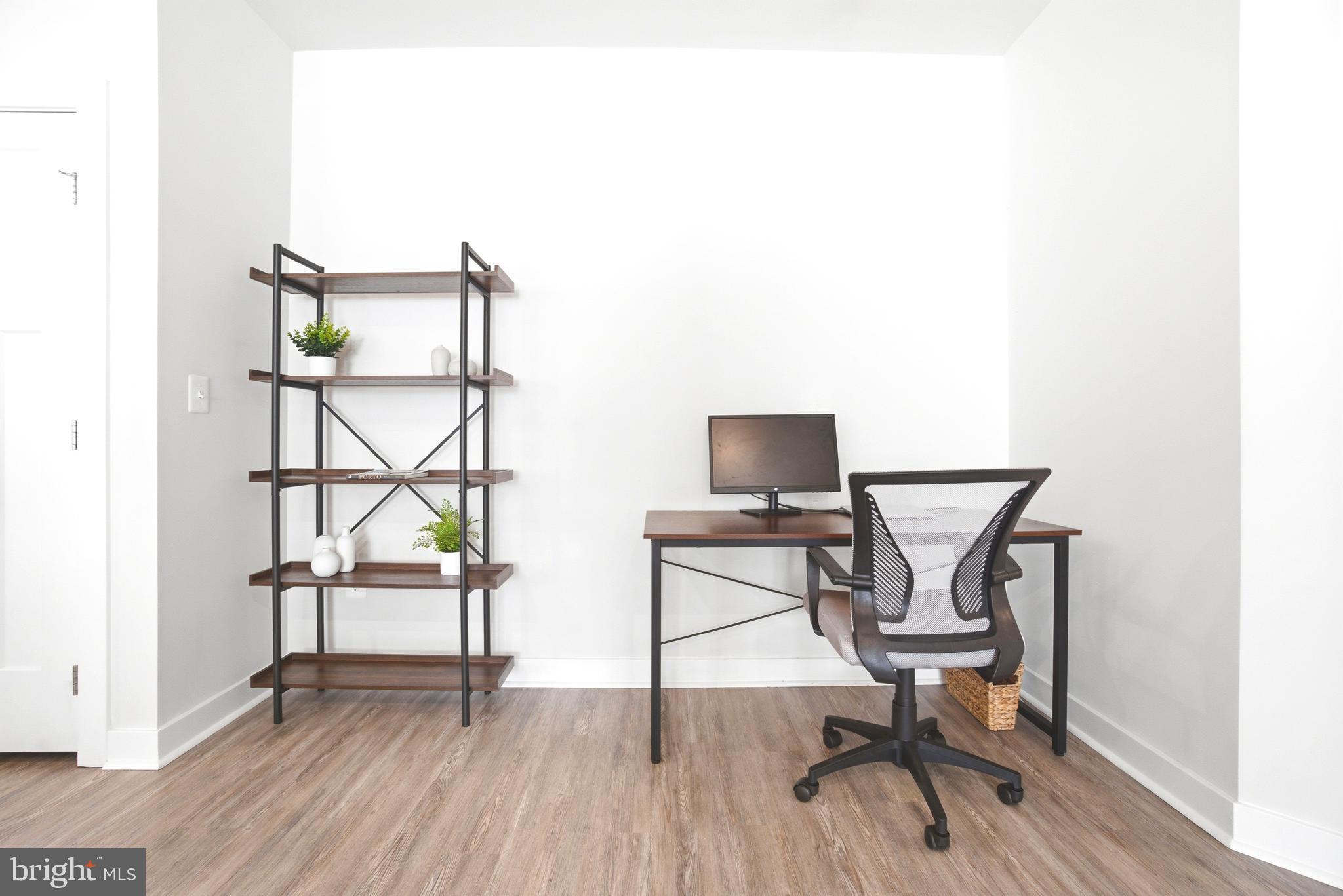 10020 Ruffian Way, Unit A Laurel, MD 20723 - Photo 9 of 36 a work room with table and chairs