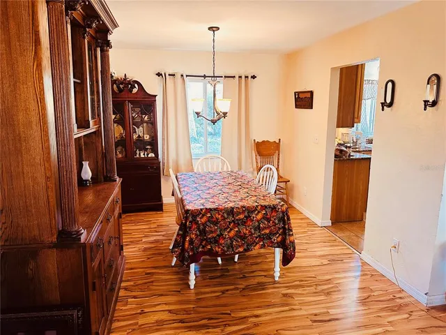 a view of a bedroom with furniture and window