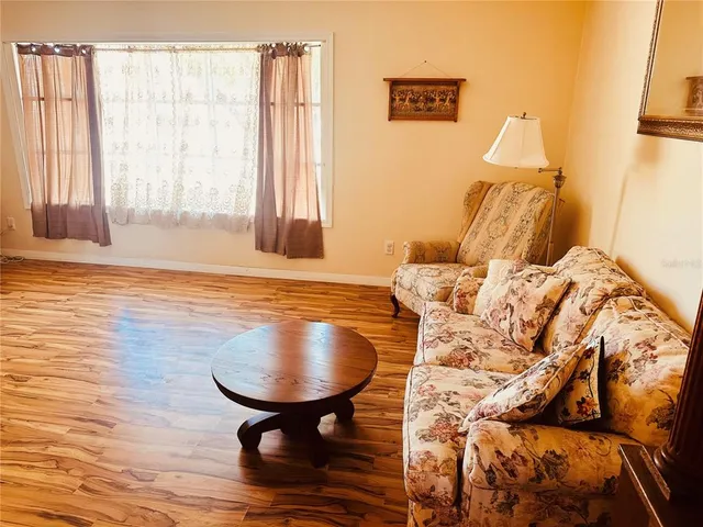 a living room with a bed and furniture