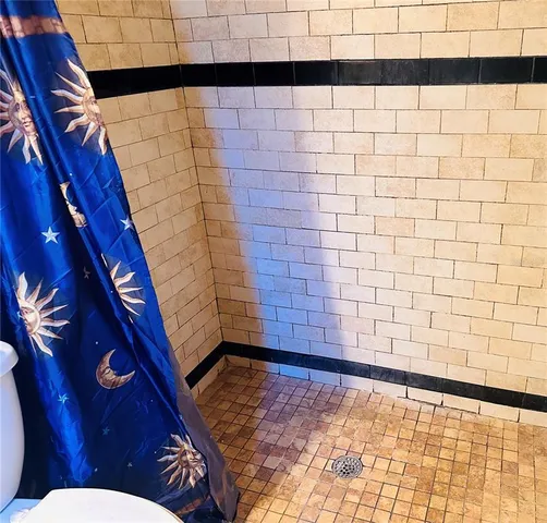 a bedroom with furniture and a wooden floor