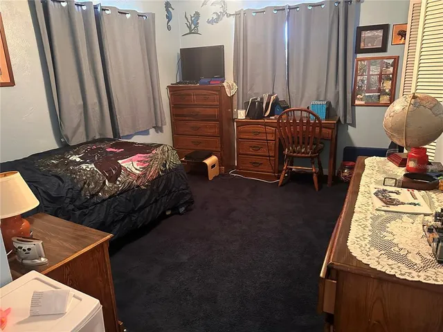 a view of a yard with trees