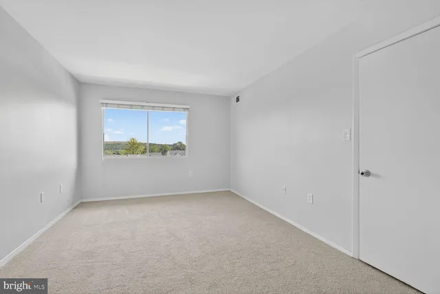 a view of a hallway with an entryway