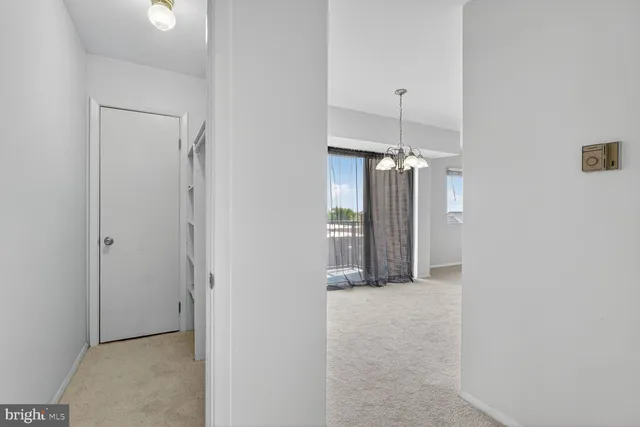 a kitchen with stainless steel appliances granite countertop a sink and a white cabinets