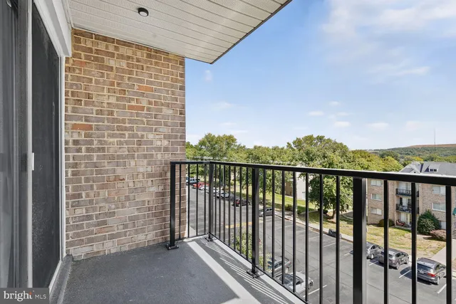 a view of staircase with white walls and windows