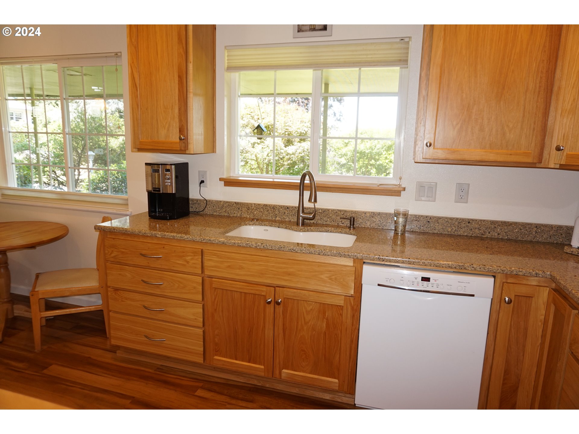 3055 Charnelton Street Eugene, OR 97405 - Photo 17 of 45 a kitchen with a sink a window and cabinets