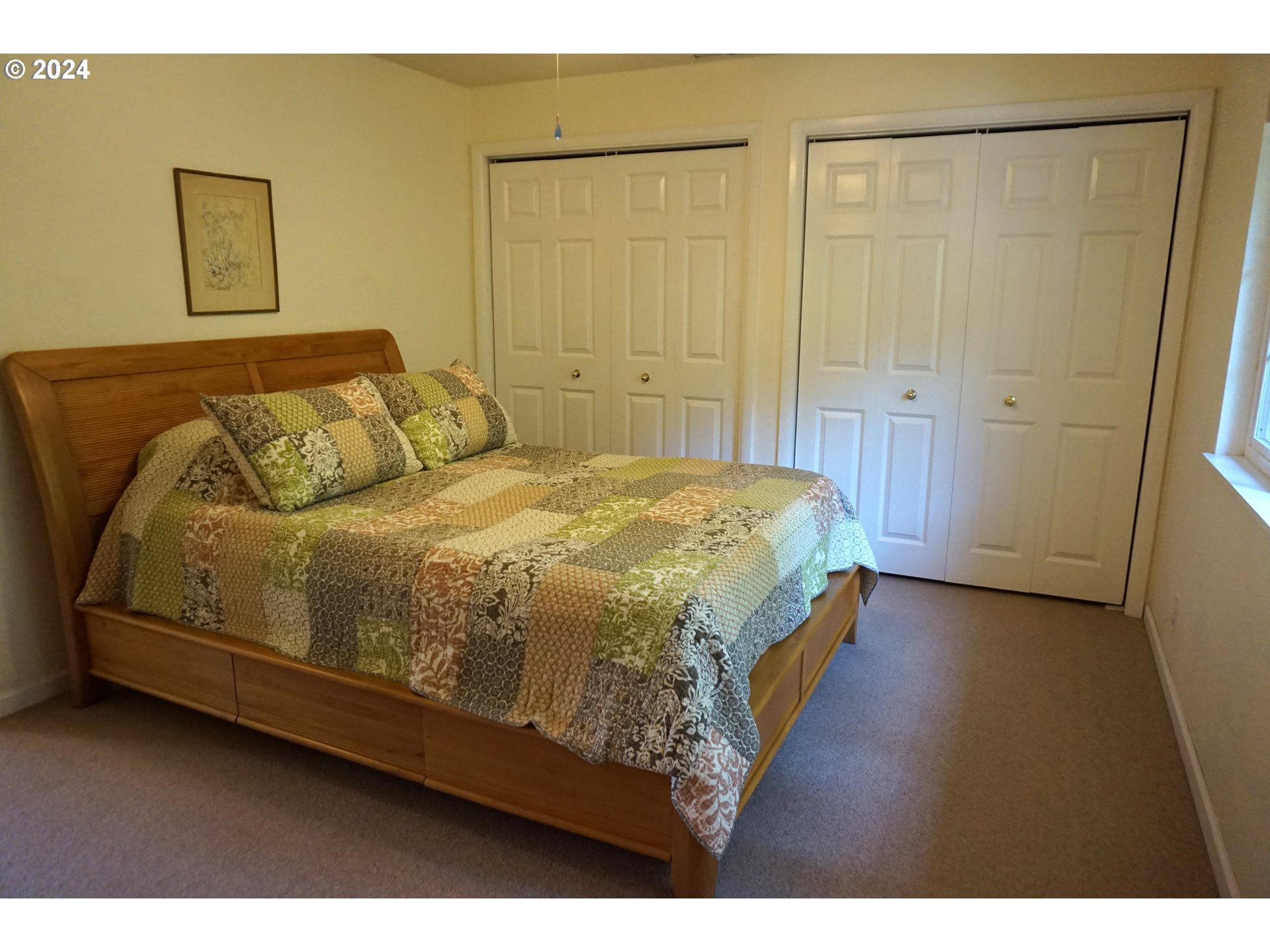 3055 Charnelton Street Eugene, OR 97405 - Photo 18 of 45 a bedroom with a bed and a painting on the wall