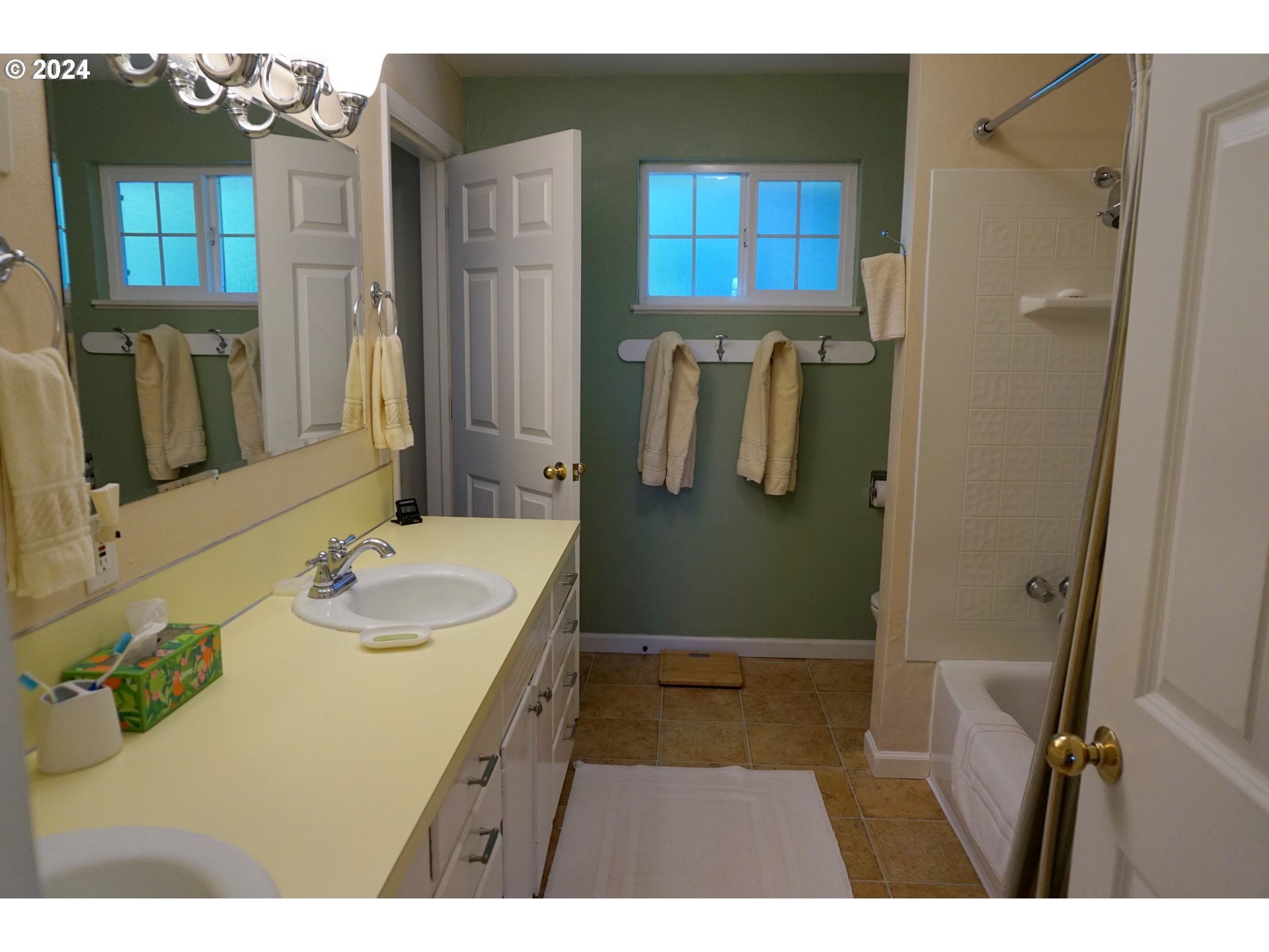 3055 Charnelton Street Eugene, OR 97405 - Photo 21 of 45 a bathroom with a sink a toilet and shower