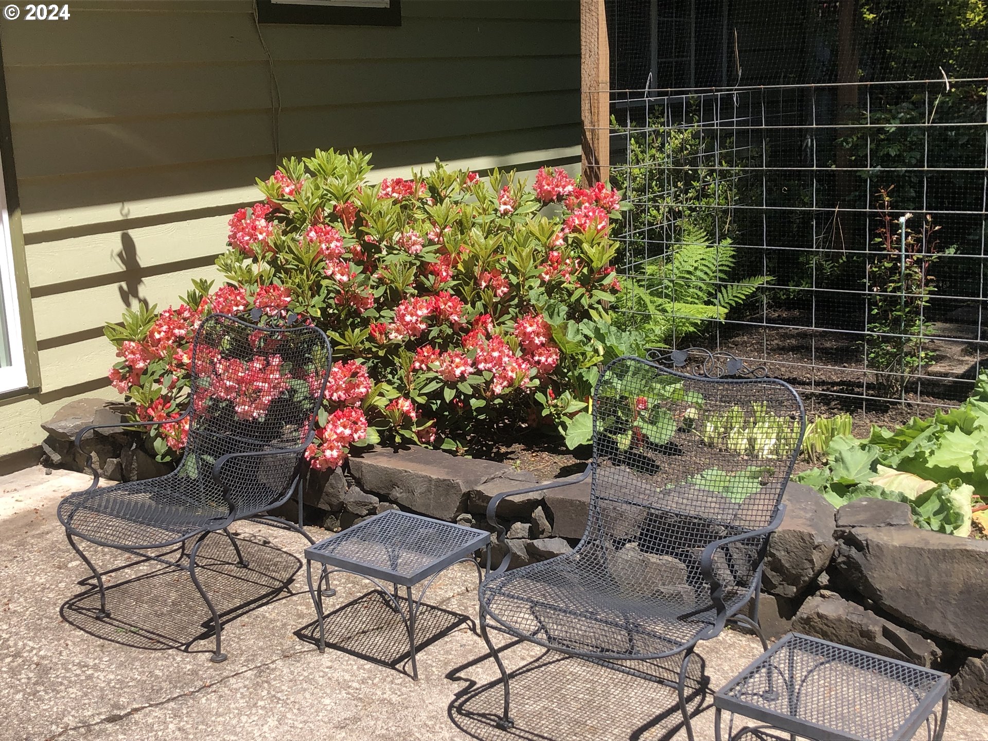3055 Charnelton Street Eugene, OR 97405 - Photo 40 of 45 a view of a chairs and table in a backyard