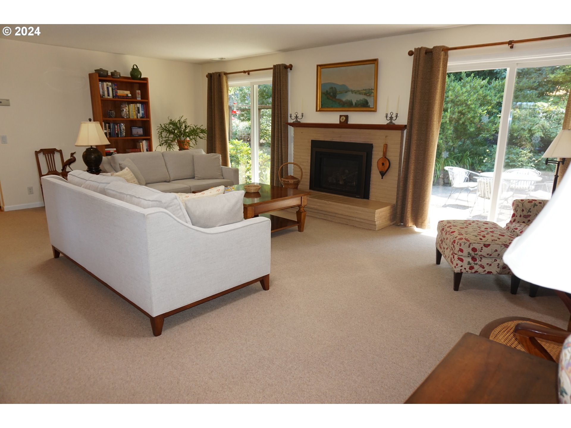 3055 Charnelton Street Eugene, OR 97405 - Photo 9 of 45 a living room with furniture and a fireplace