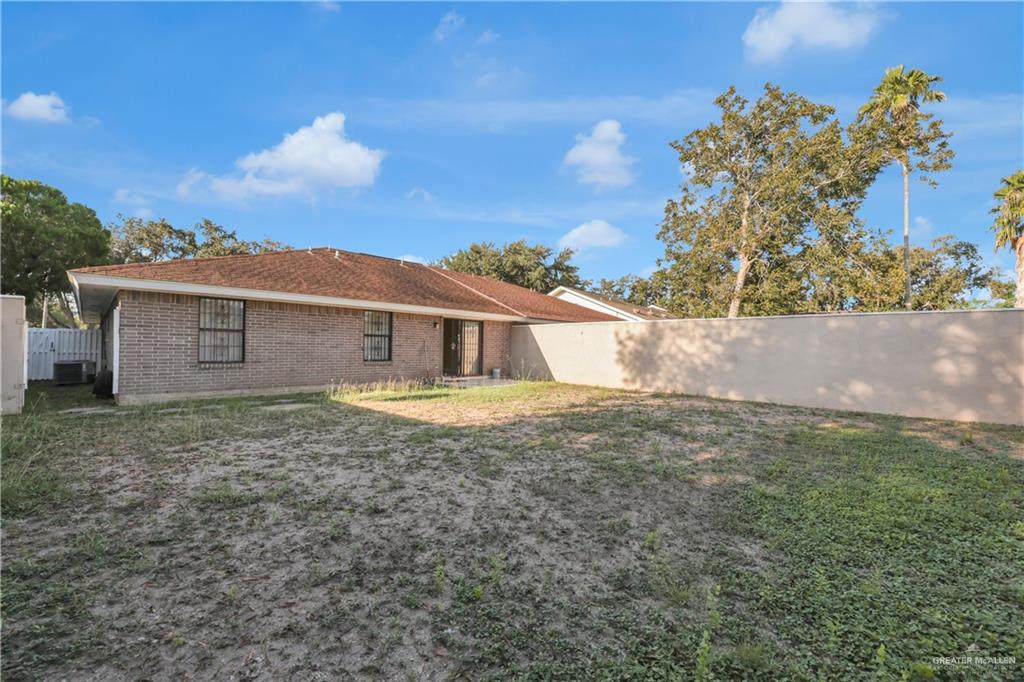 2401 South Jackson Road, Unit 9 Pharr, TX 78577 - Photo 17 of 17 a view of a house with a yard