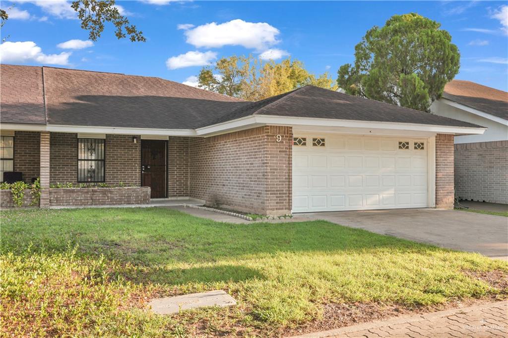 2401 South Jackson Road, Unit 9 Pharr, TX 78577 - Photo 2 of 17 a view of a house with a yard
