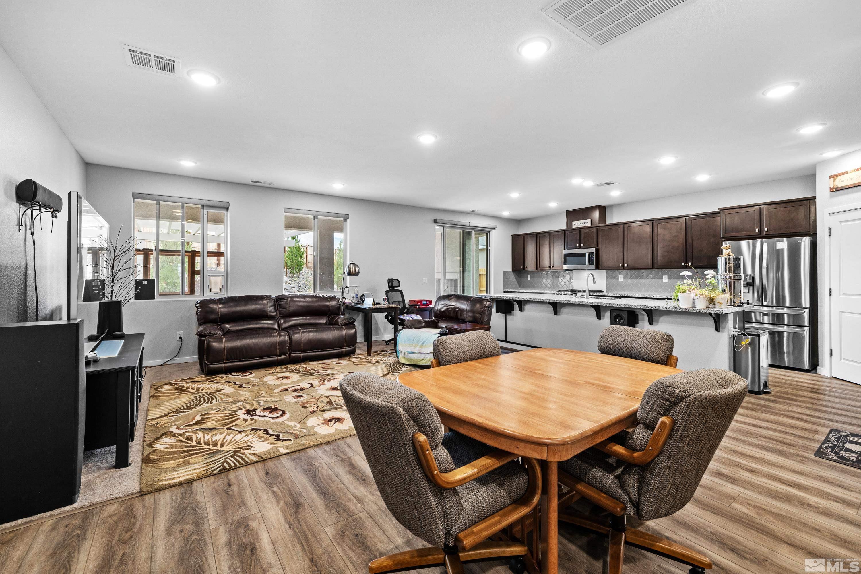 7217 Mustengo Drive Reno, NV 89506 - Photo 12 of 36 a large kitchen with a table and chairs