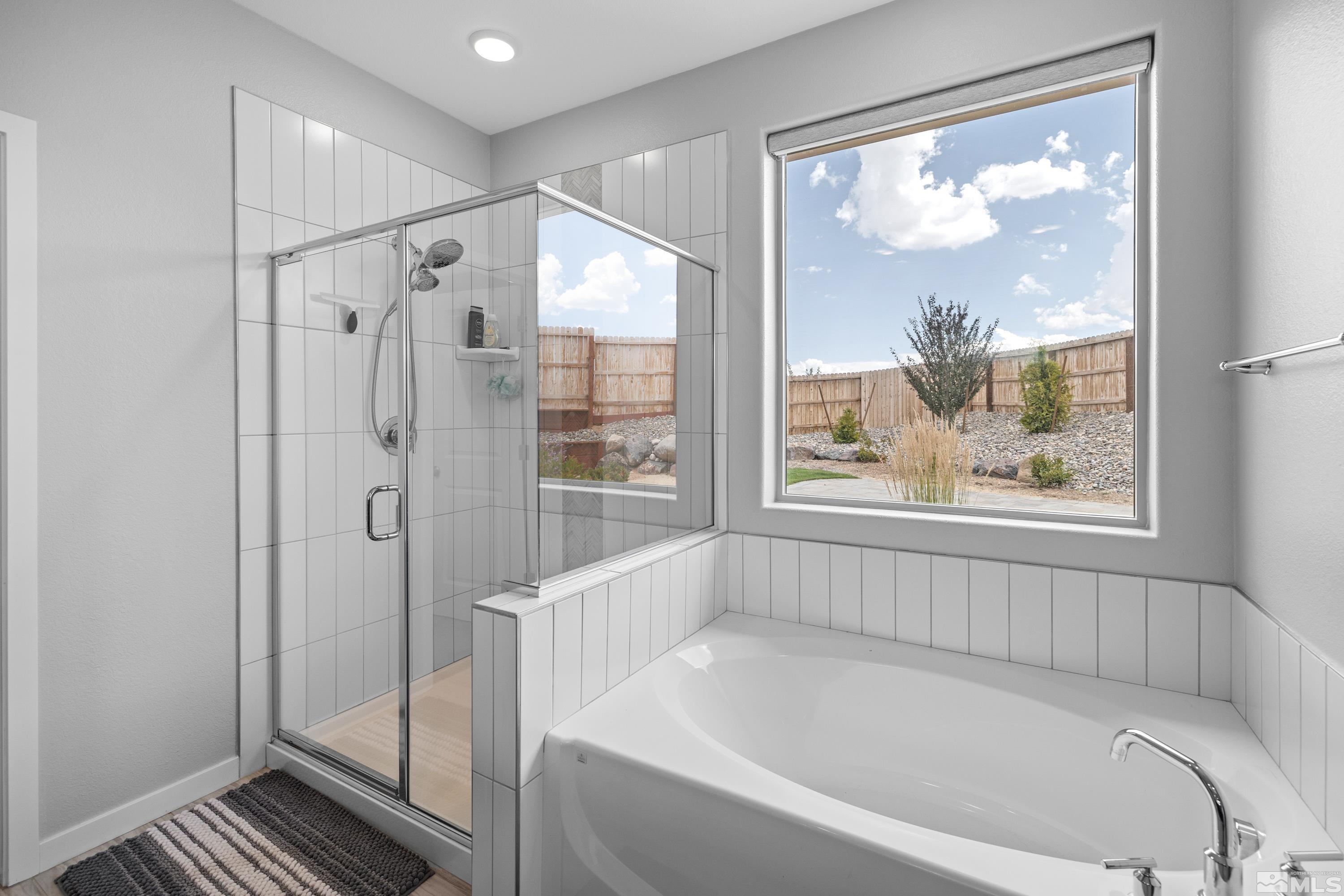 7217 Mustengo Drive Reno, NV 89506 - Photo 20 of 36 a bathroom with a bathtub and a shower