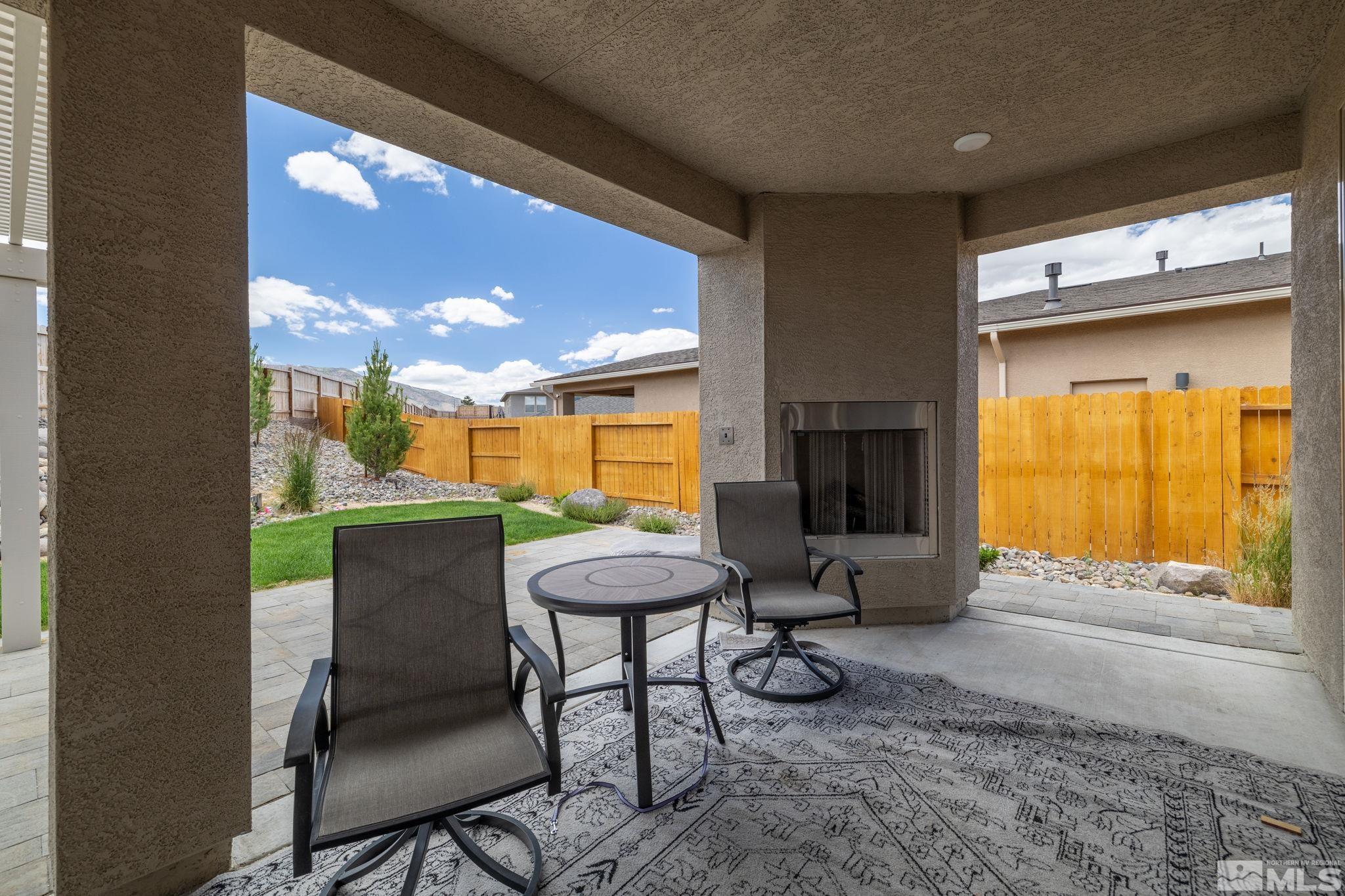 7217 Mustengo Drive Reno, NV 89506 - Photo 24 of 36 a view of a porch with furniture and a yard