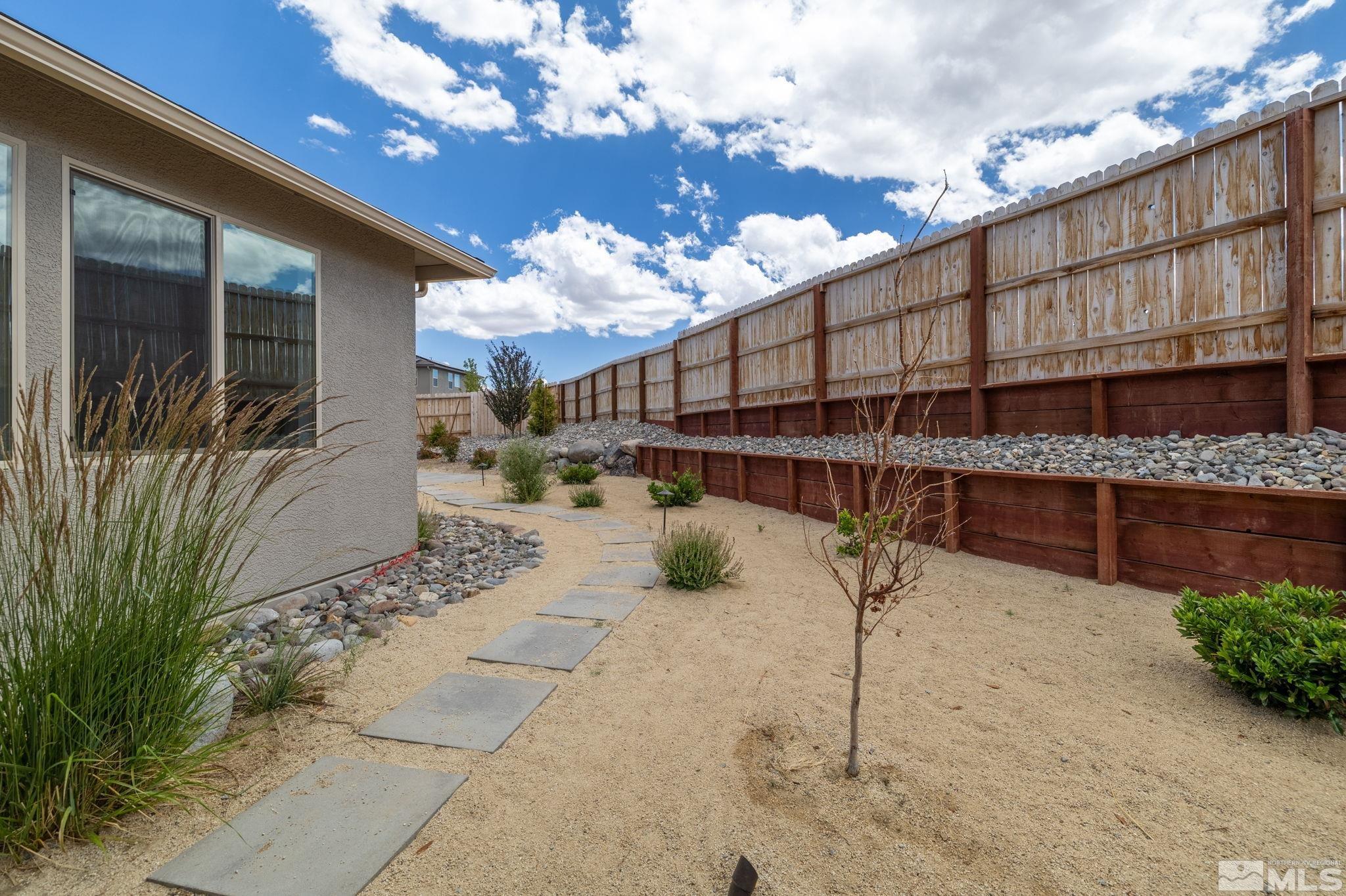 7217 Mustengo Drive Reno, NV 89506 - Photo 25 of 36 a view of a house with a patio
