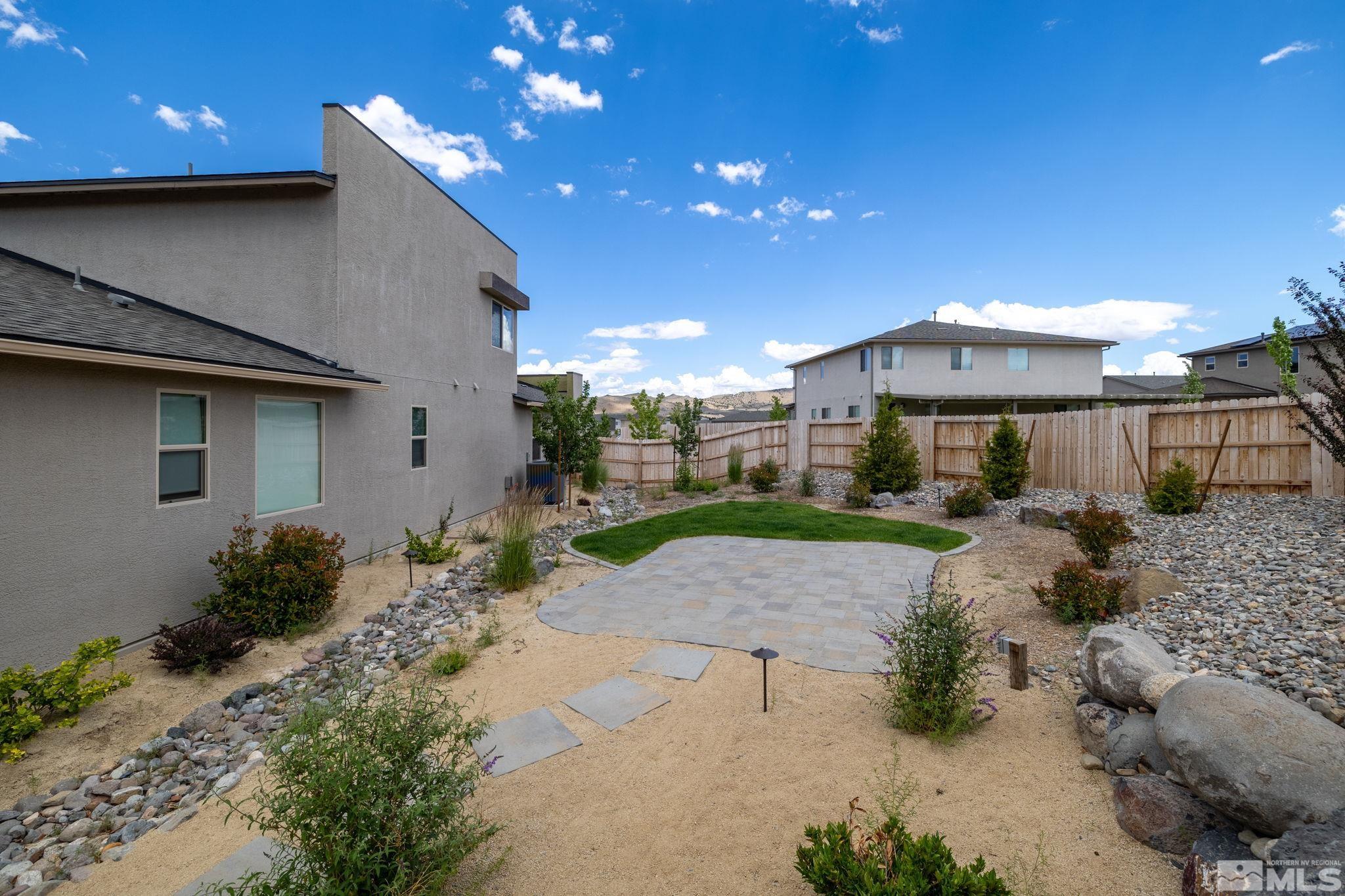 7217 Mustengo Drive Reno, NV 89506 - Photo 26 of 36 a view of a patio with a yard