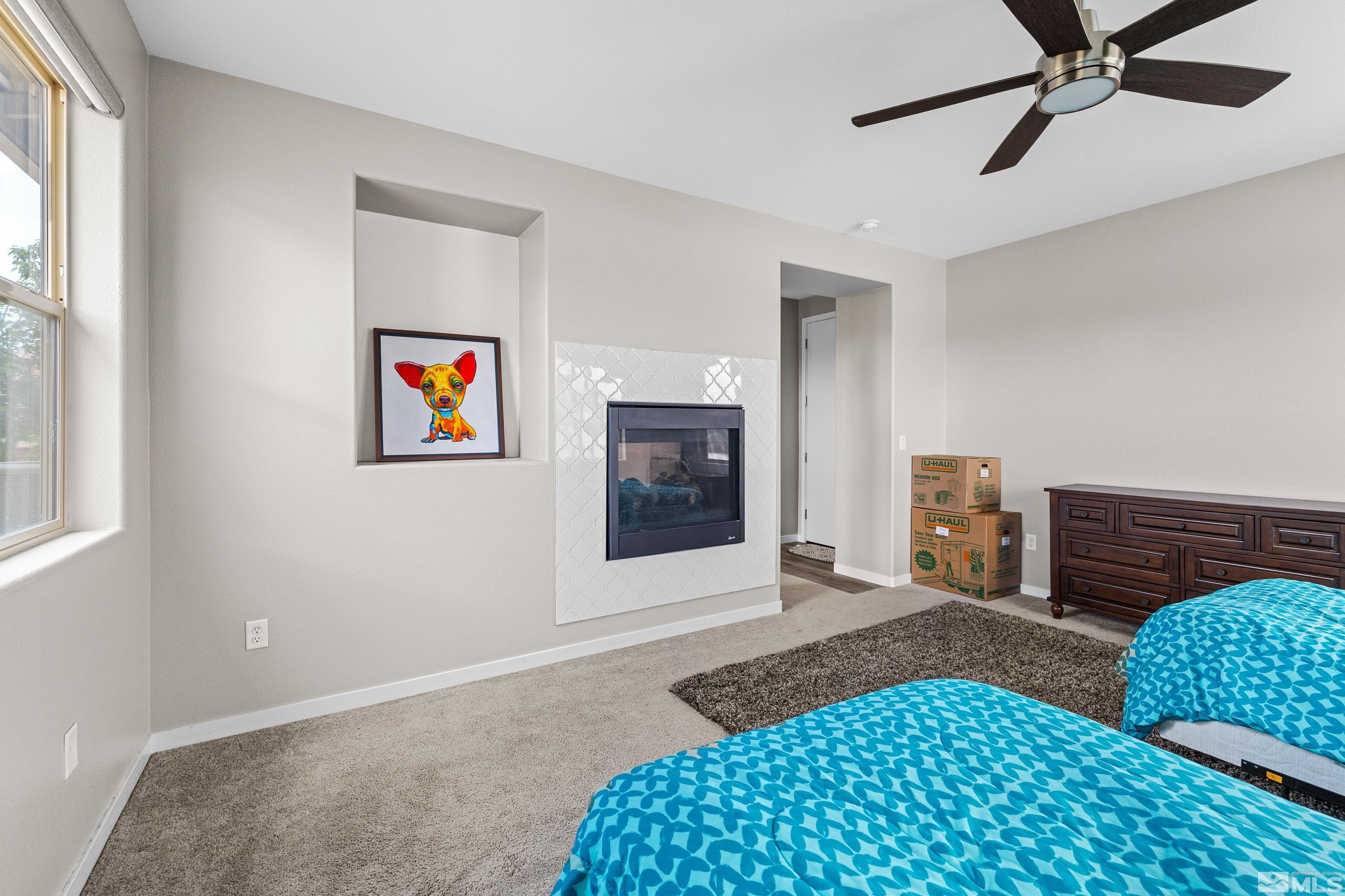 7217 Mustengo Drive Reno, NV 89506 - Photo 5 of 36 a bedroom with furniture and a window