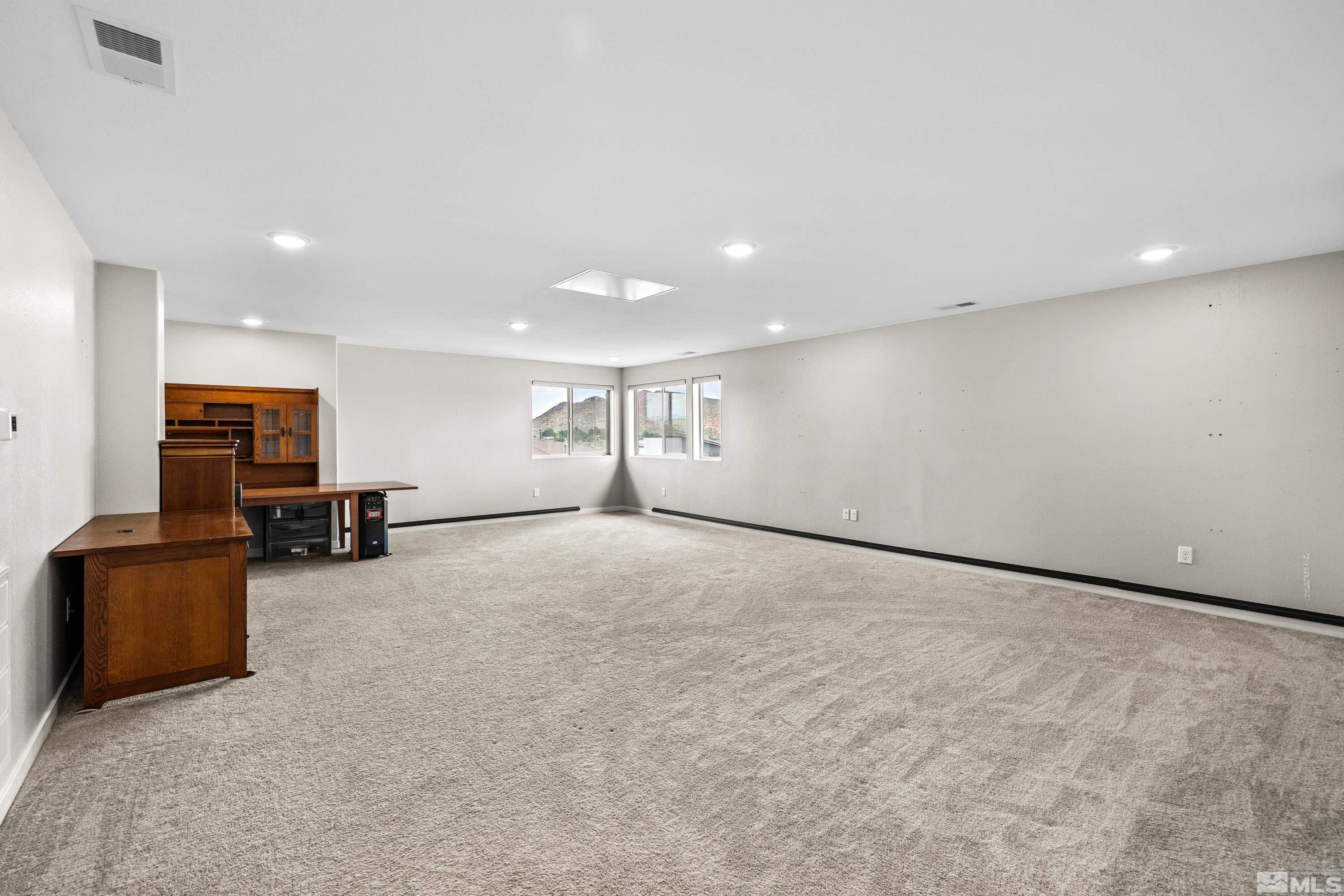 7217 Mustengo Drive Reno, NV 89506 - Photo 7 of 36 a view of empty room with furniture and window
