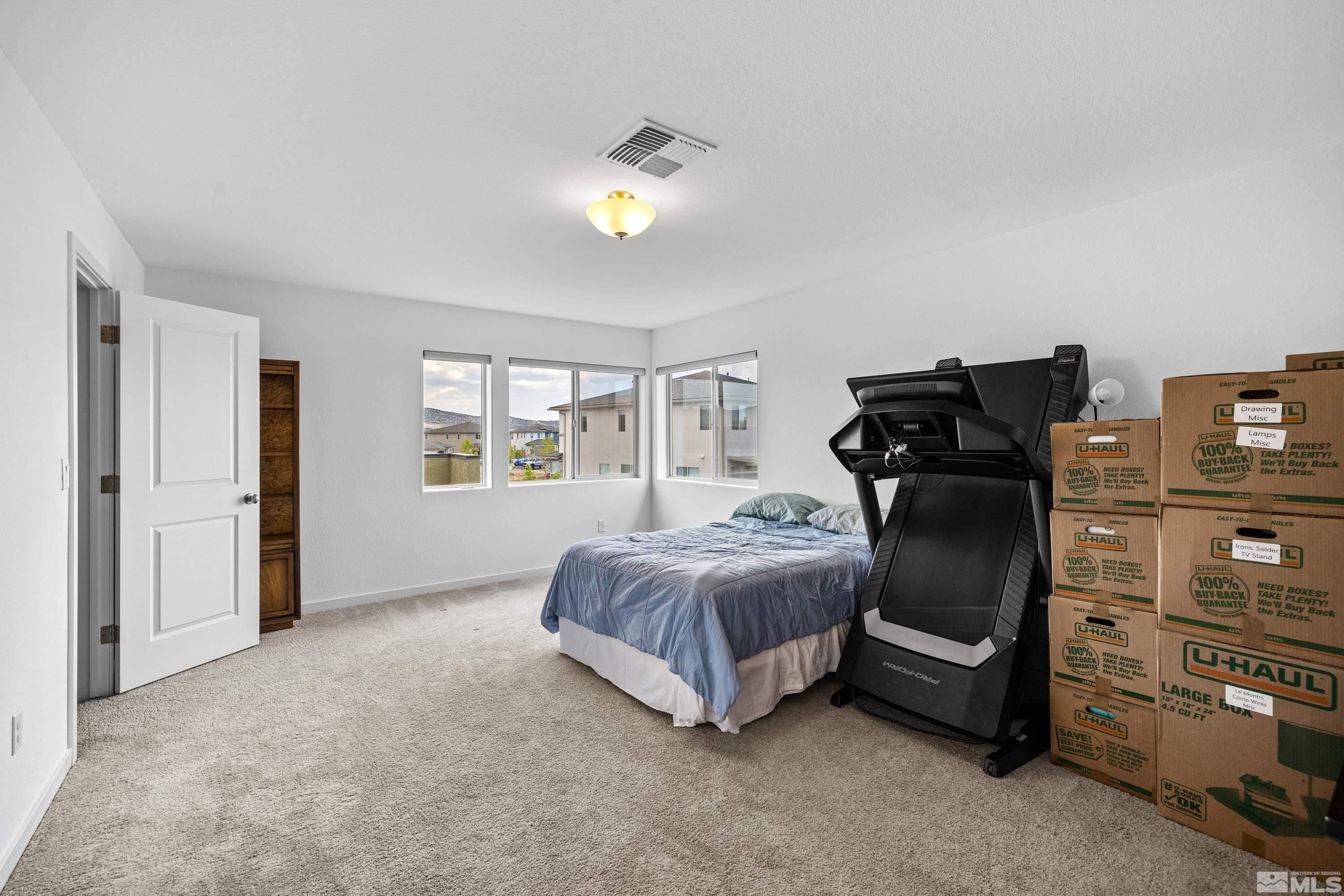 7217 Mustengo Drive Reno, NV 89506 - Photo 9 of 36 a bedroom with a bed and a window