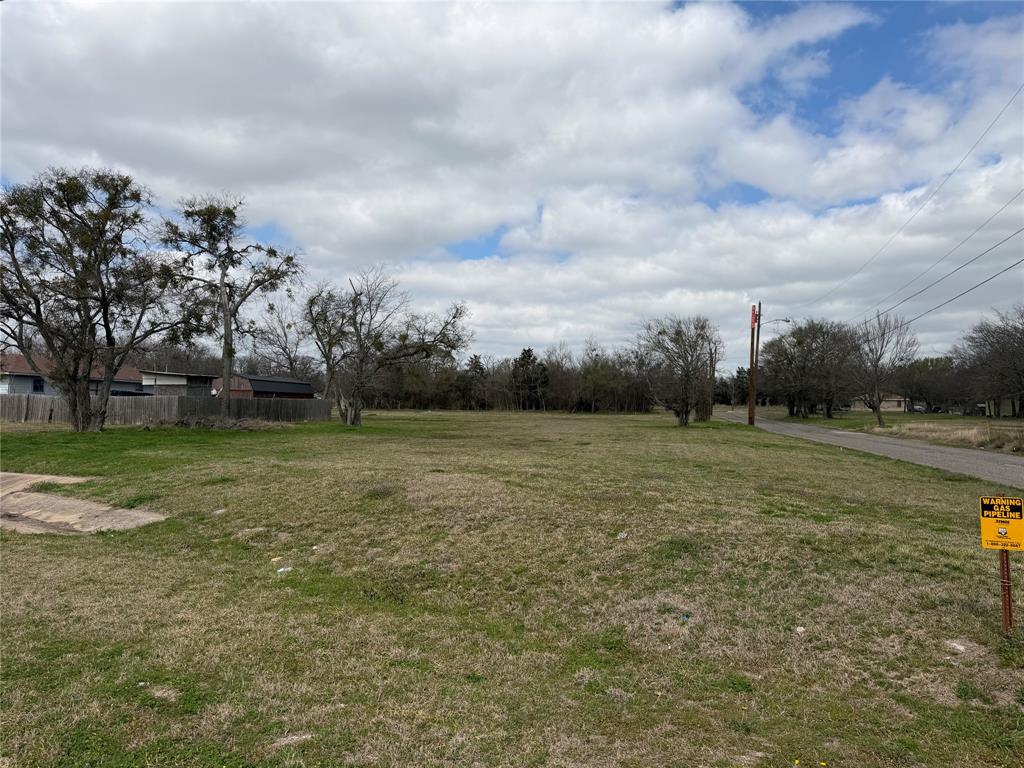 102 Johnson Street Commerce, TX 75428 - Photo 5 of 7 a view of outdoor space with green field