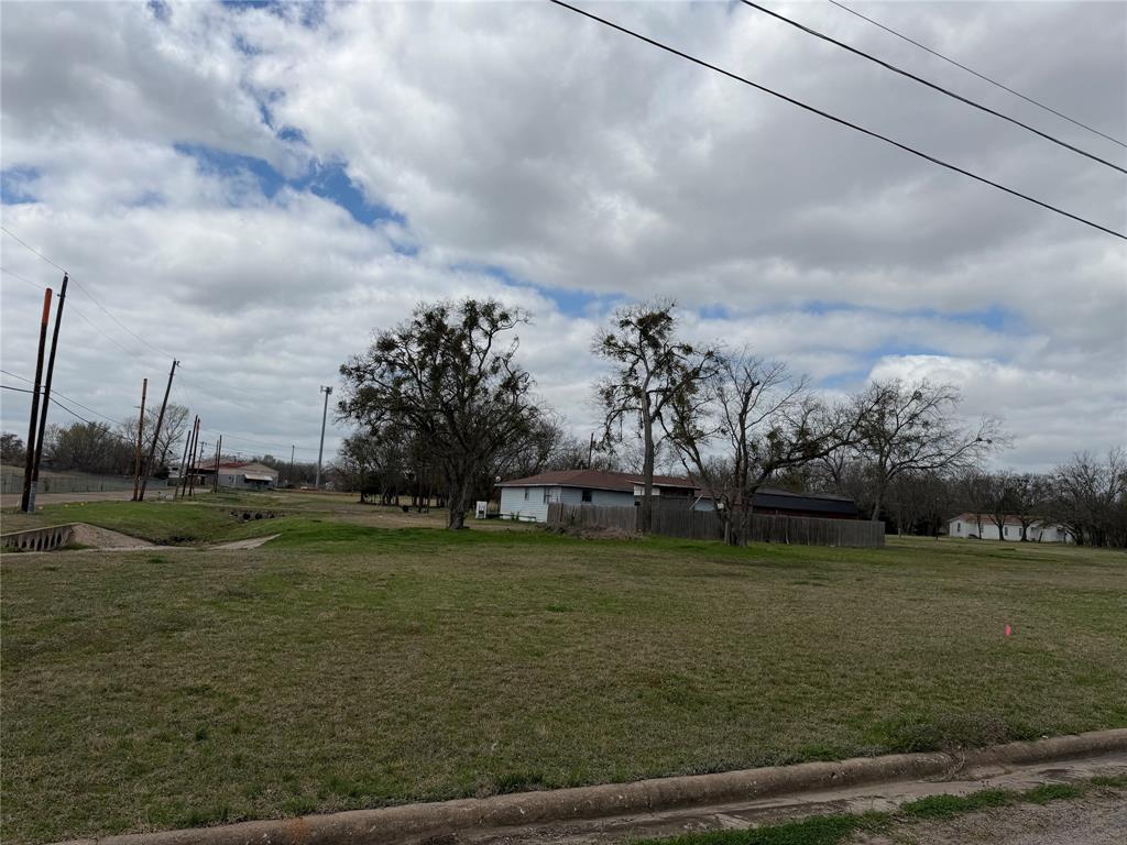 102 Johnson Street Commerce, TX 75428 - Photo 6 of 7 a view of a field with sitting area