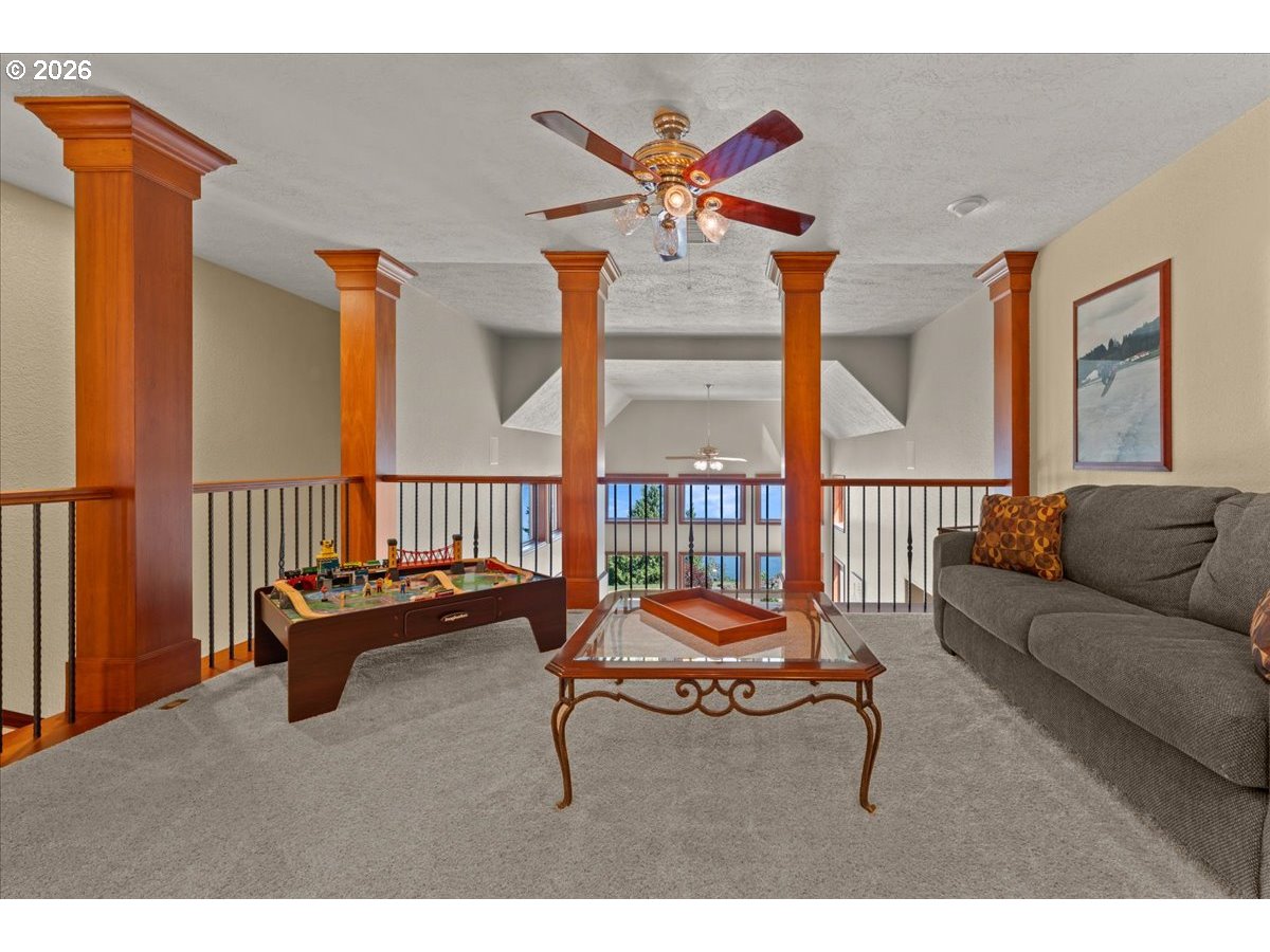 37123 Northeast Reed Road Corbett, OR 97019 - Photo 33 of 48 a living room with furniture and a flat screen tv