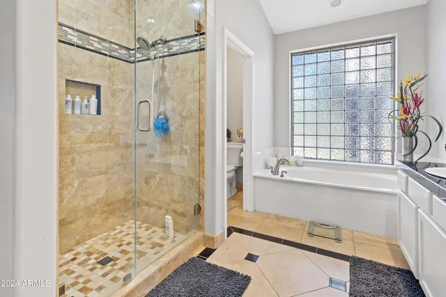 a bathroom with a bathtub and a shower