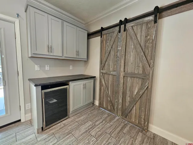 a kitchen with a sink and a refrigerator