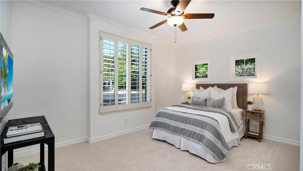 16 Bayleaf Lane Irvine, CA 92620 - Photo 14 of 66 a bedroom with a bed a wall painting and a window