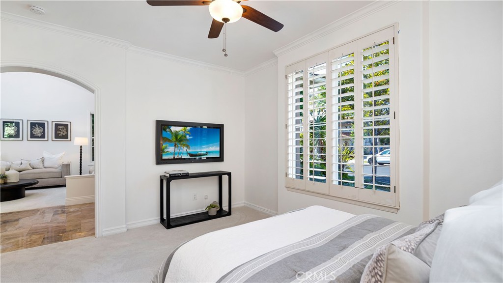 16 Bayleaf Lane Irvine, CA 92620 - Photo 15 of 66 a bedroom with a bed and a painting on the wall