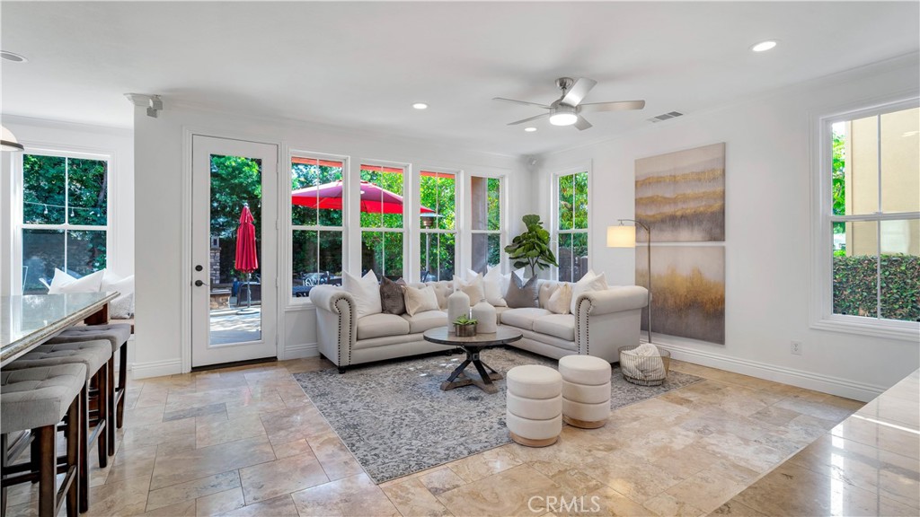 16 Bayleaf Lane Irvine, CA 92620 - Photo 20 of 66 a living room with furniture and a flat screen tv
