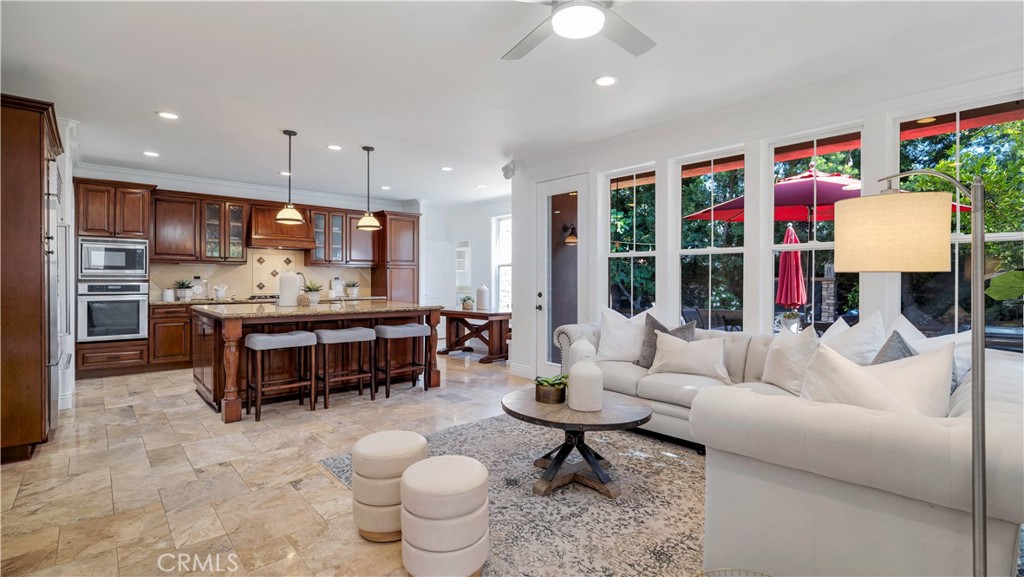 16 Bayleaf Lane Irvine, CA 92620 - Photo 21 of 66 a living room with furniture and a kitchen area