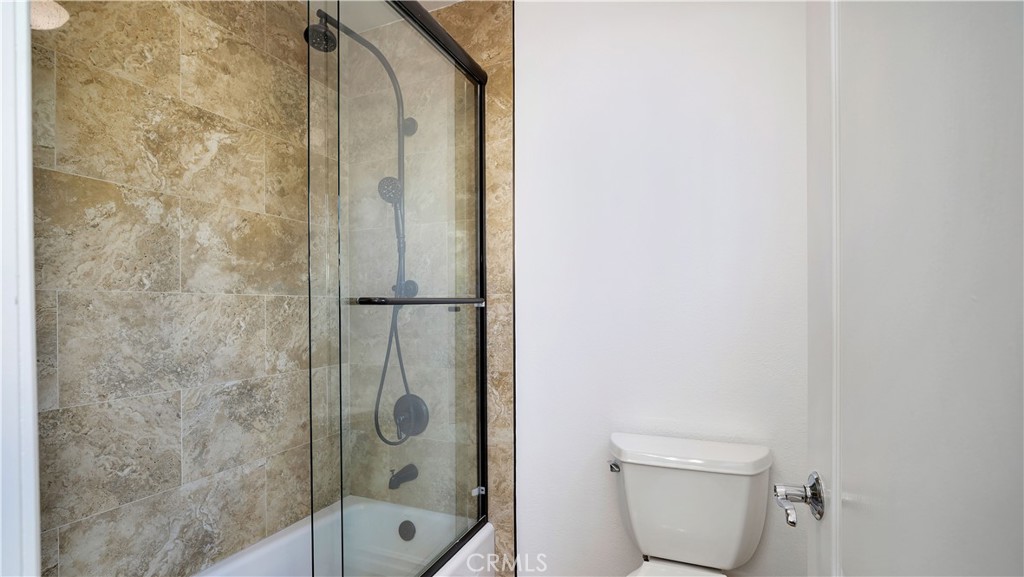 16 Bayleaf Lane Irvine, CA 92620 - Photo 38 of 66 a bathroom with a shower and toilet