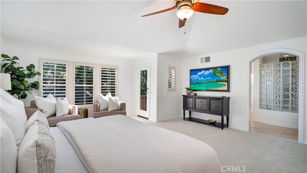 16 Bayleaf Lane Irvine, CA 92620 - Photo 41 of 66 a bedroom with furniture and a flat screen tv