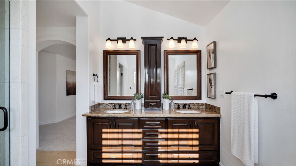 16 Bayleaf Lane Irvine, CA 92620 - Photo 44 of 66 a bathroom with a sink and a mirror