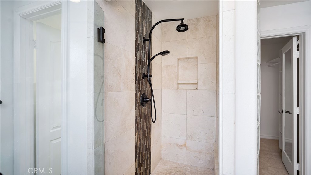 16 Bayleaf Lane Irvine, CA 92620 - Photo 45 of 66 a bathroom with a glass shower door
