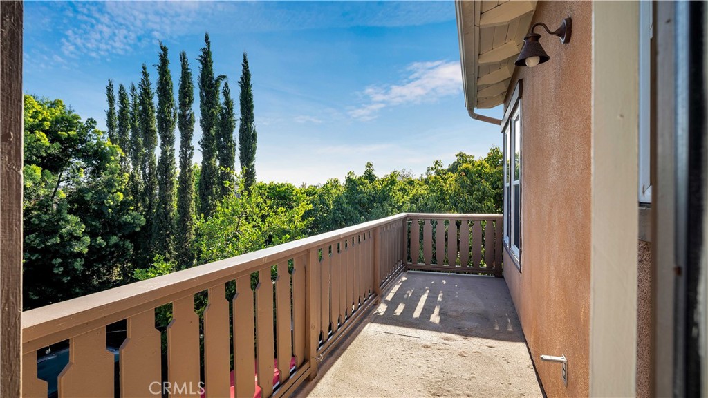 16 Bayleaf Lane Irvine, CA 92620 - Photo 47 of 66 a view of balcony with wooden floor and fence