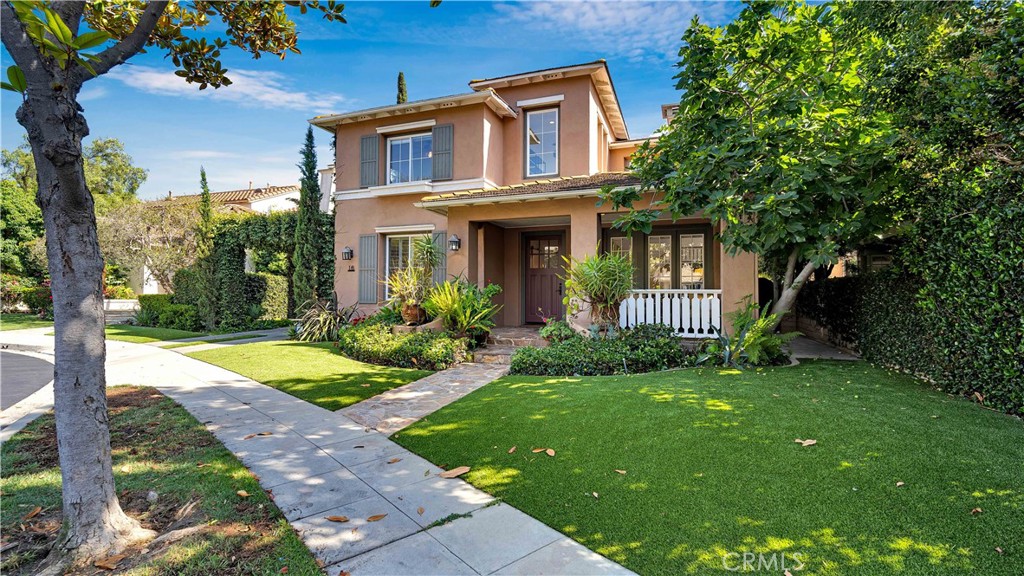 16 Bayleaf Lane Irvine, CA 92620 - Photo 5 of 66 a view of a brick house with a yard plants and large tree