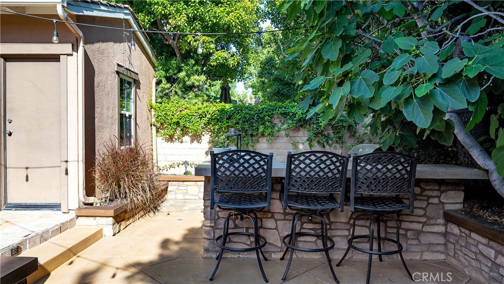 16 Bayleaf Lane Irvine, CA 92620 - Photo 55 of 66 a view of a patio with table and chairs and potted plants