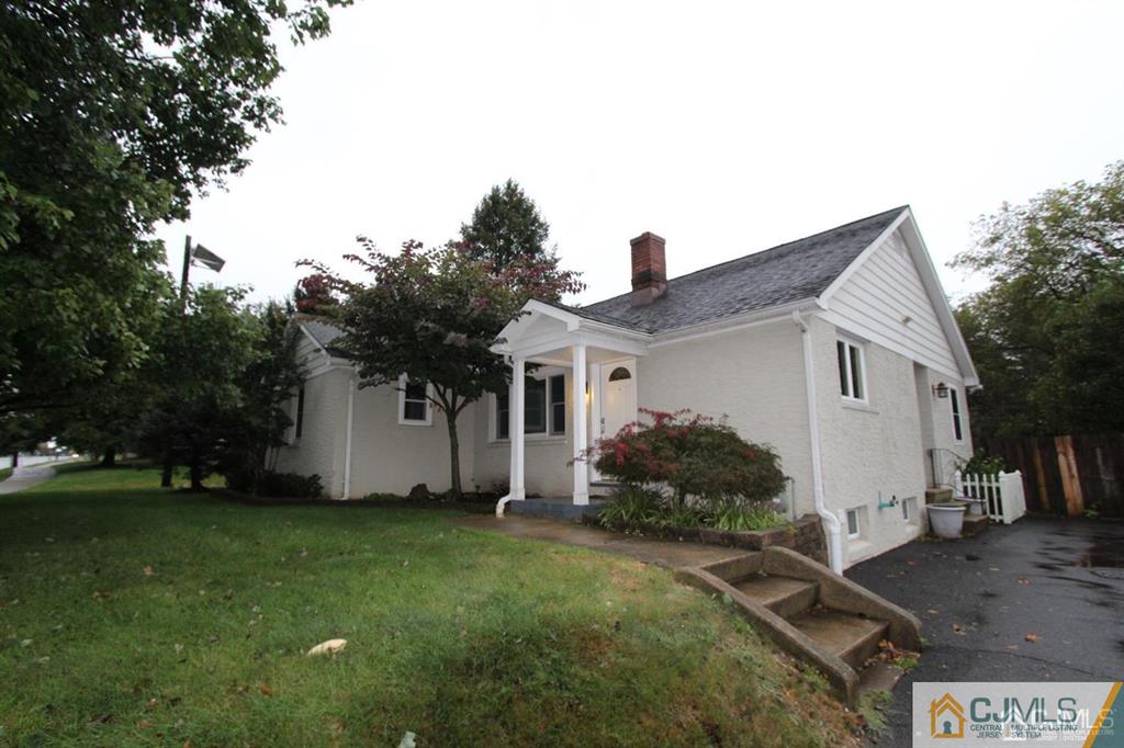 104 Grovers Mill Road Plainsboro, NJ 08536 - Photo 1 of 21 a front view of a house with a yard and garage