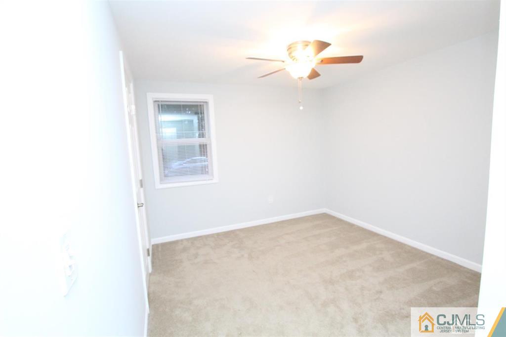 104 Grovers Mill Road Plainsboro, NJ 08536 - Photo 15 of 21 an empty room with a window