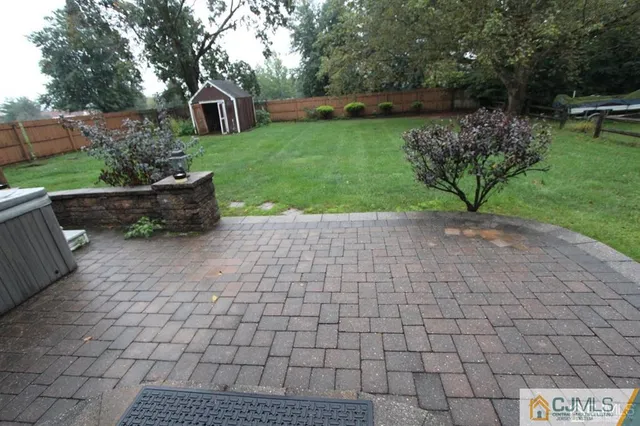 a view of a backyard with sitting area
