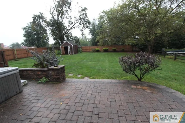 a view of a garden with a bench in garden