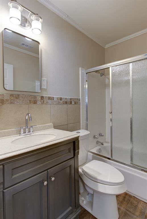 913 North 32nd Street Waco, TX 76707 - Photo 8 of 12 a bathroom with a sink a toilet and shower