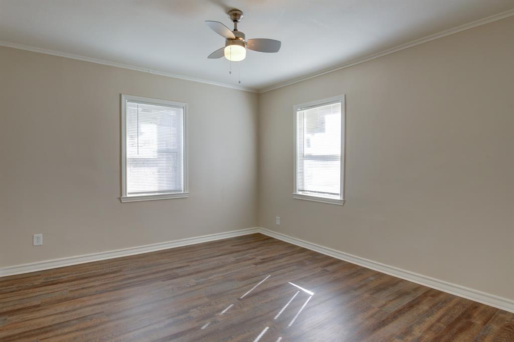 913 North 32nd Street Waco, TX 76707 - Photo 9 of 12 a view of an empty room with wooden floor and a window