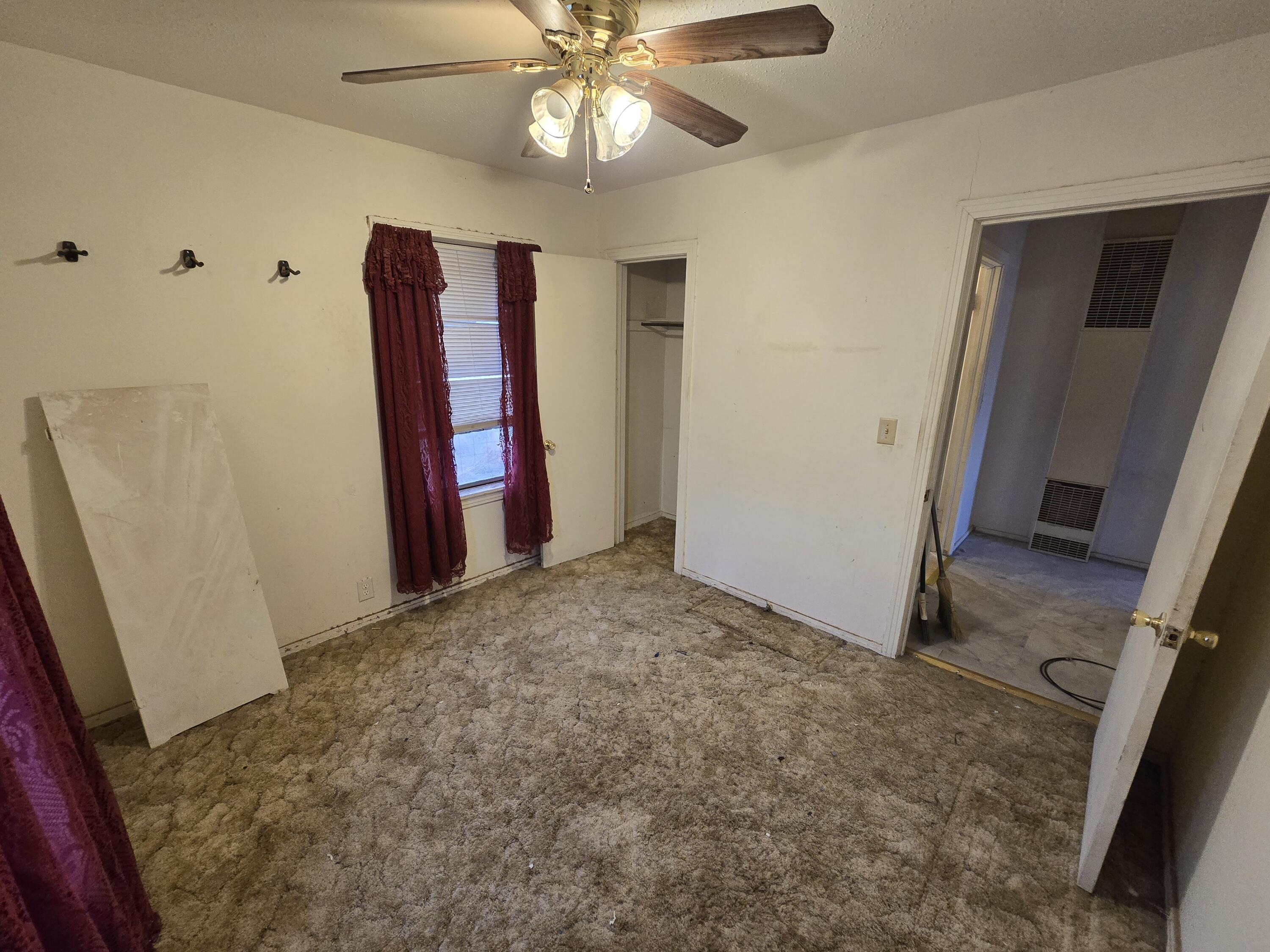 807 Northwest 8th Street Seminole, TX 79360 - Photo 11 of 15 a view of an entryway with a ceiling fan
