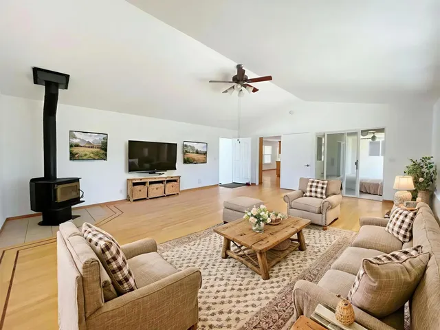 a view of empty room with ceiling fan