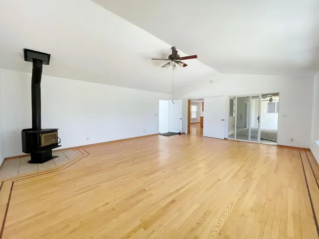 a kitchen with stainless steel appliances granite countertop white cabinets sink and stove